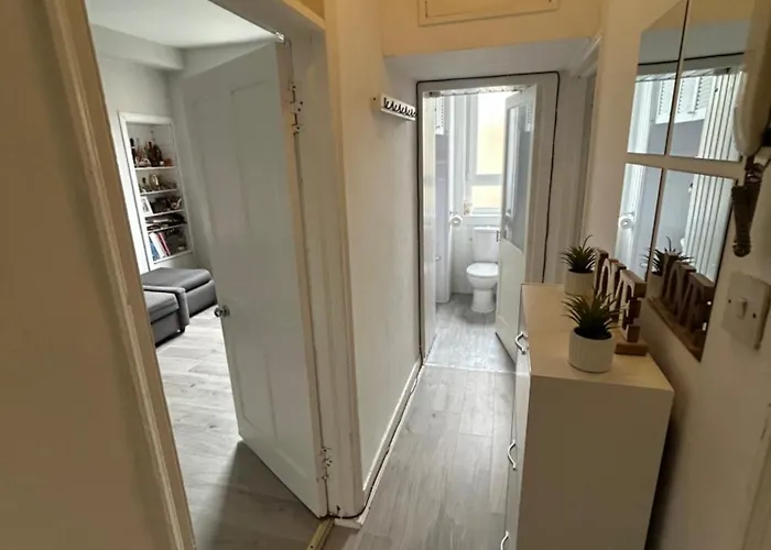 Bright Bedroom With King Side Bed And Share Bathroom Apartment